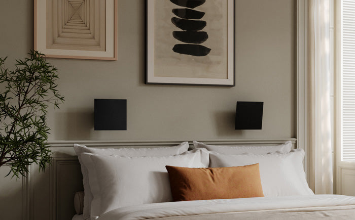 101 Copenhagen Chameleon Wall Lamp over a bed