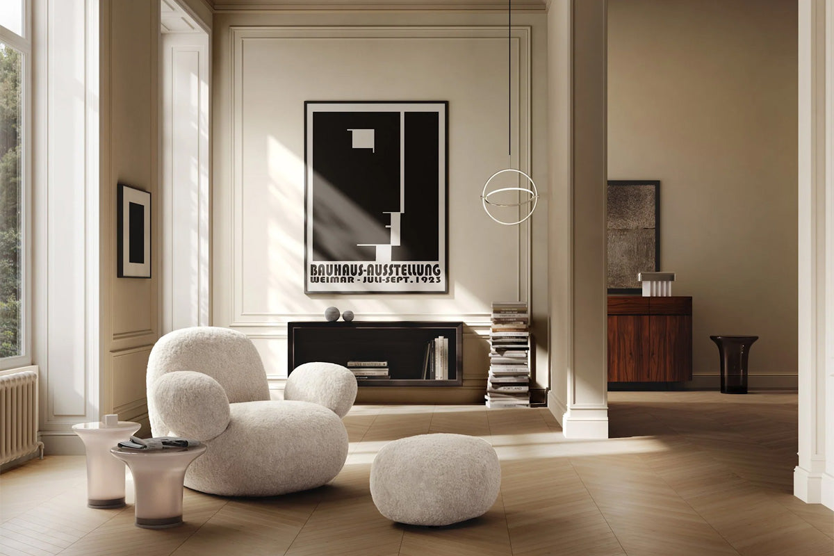 101 Copenhagen Sheepskin Armchair, glass tables, and Maru pendant