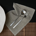 101 Copenhagen Kogei Salad Servers - Brushed Steel on Napkin