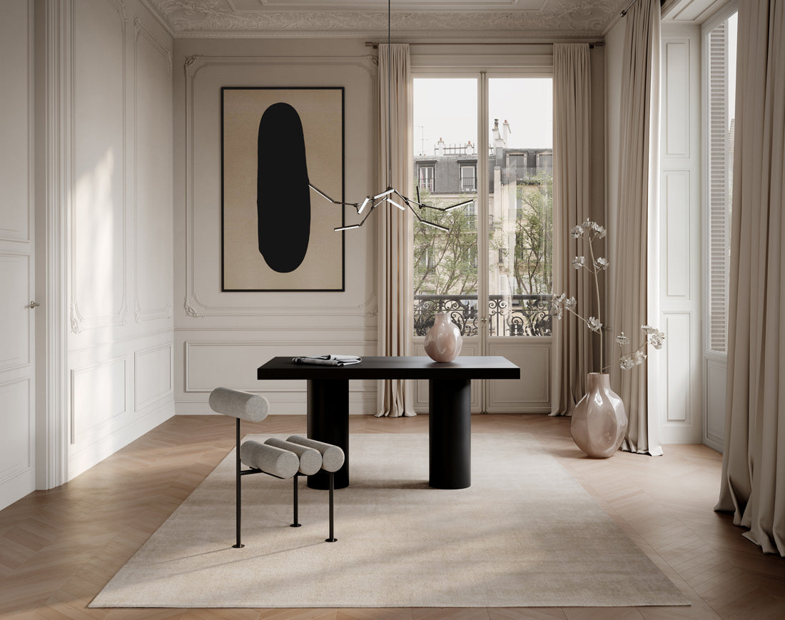 Modern interior design with a black table Hiro dining chair, Bakku vases and a Stick chandleier in a office with large windows.