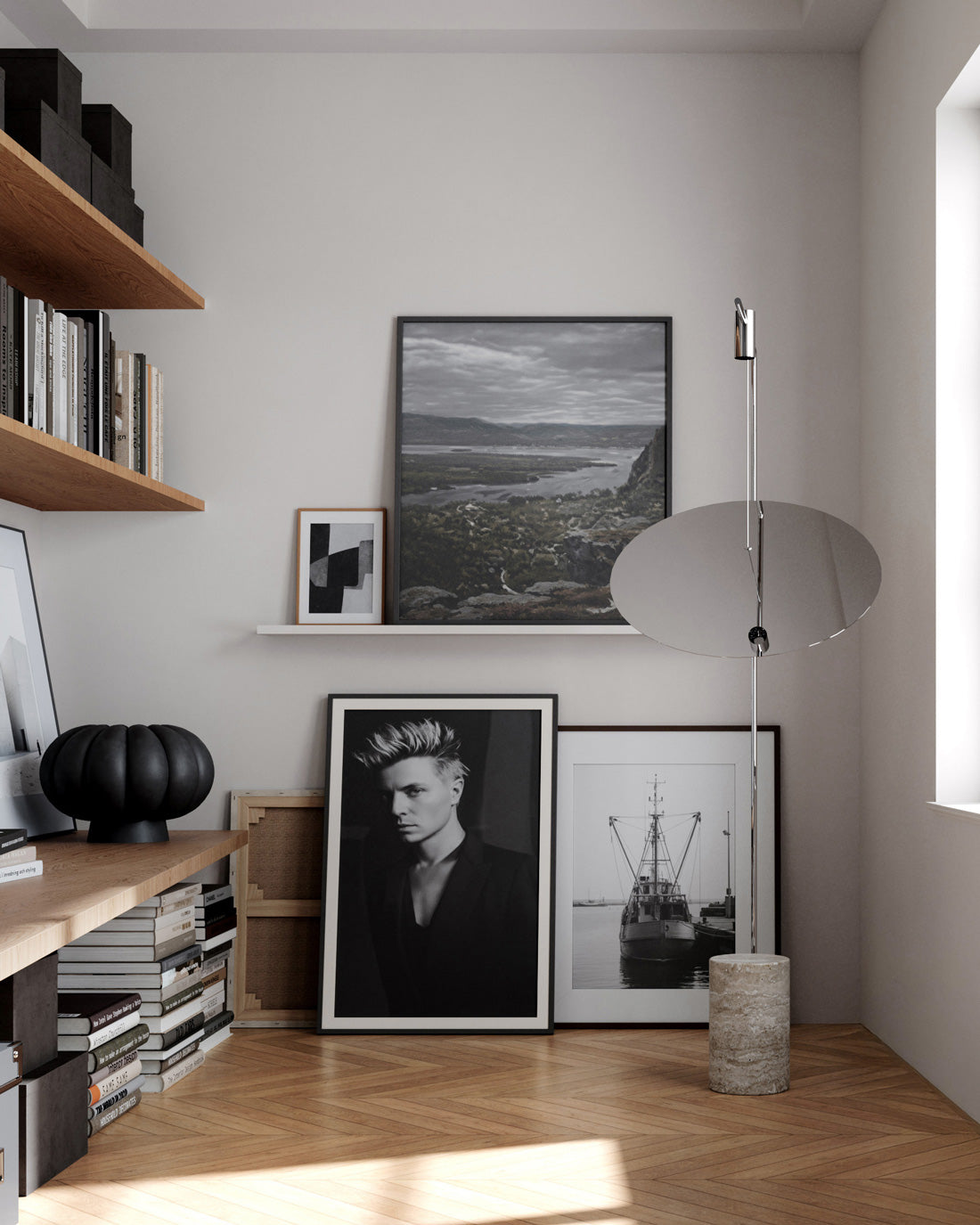 Modern interior with wooden shelves, framed pictures, and a 101 Copenhagen Moon floor lamp and Kabin Lamella Vase.
