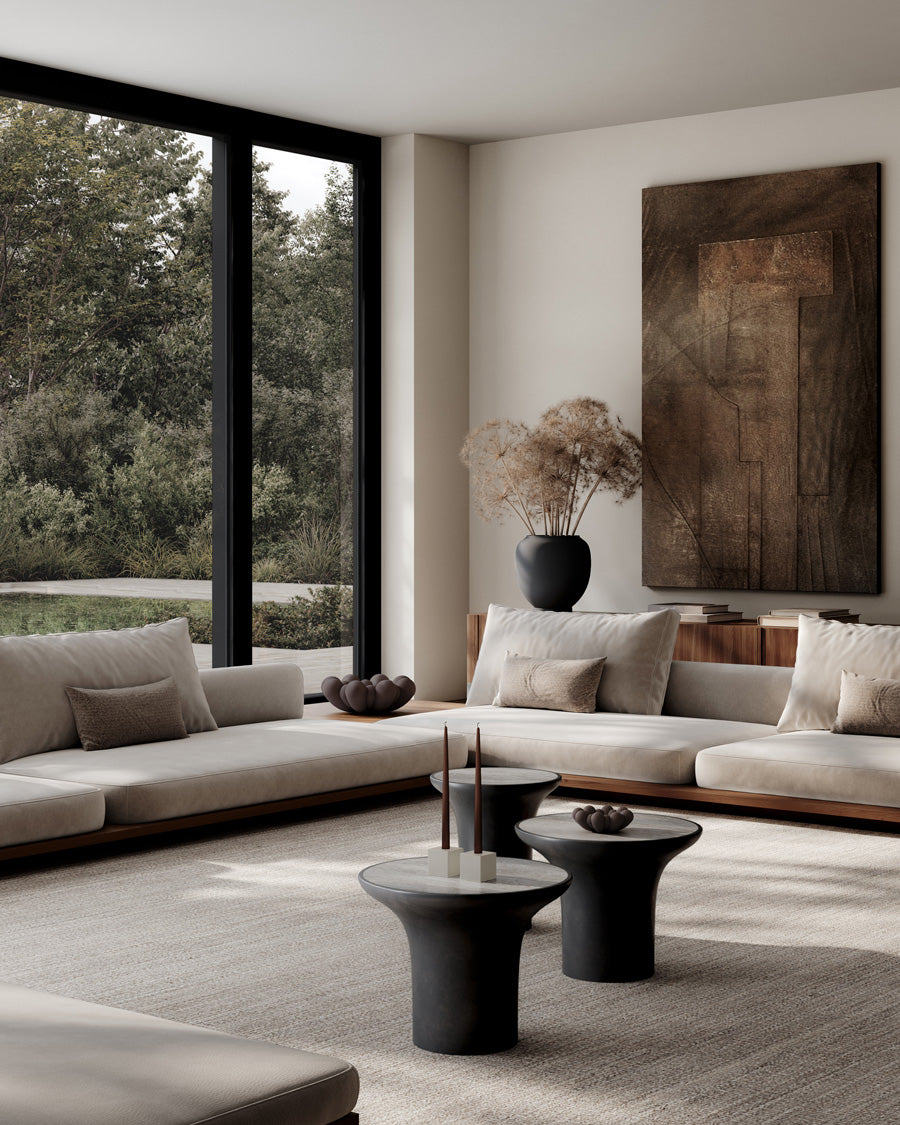 Modern living room Trumpet coffee tables, Bloom Trays, Cube candle holder, Sunao Plant pot and a large window.