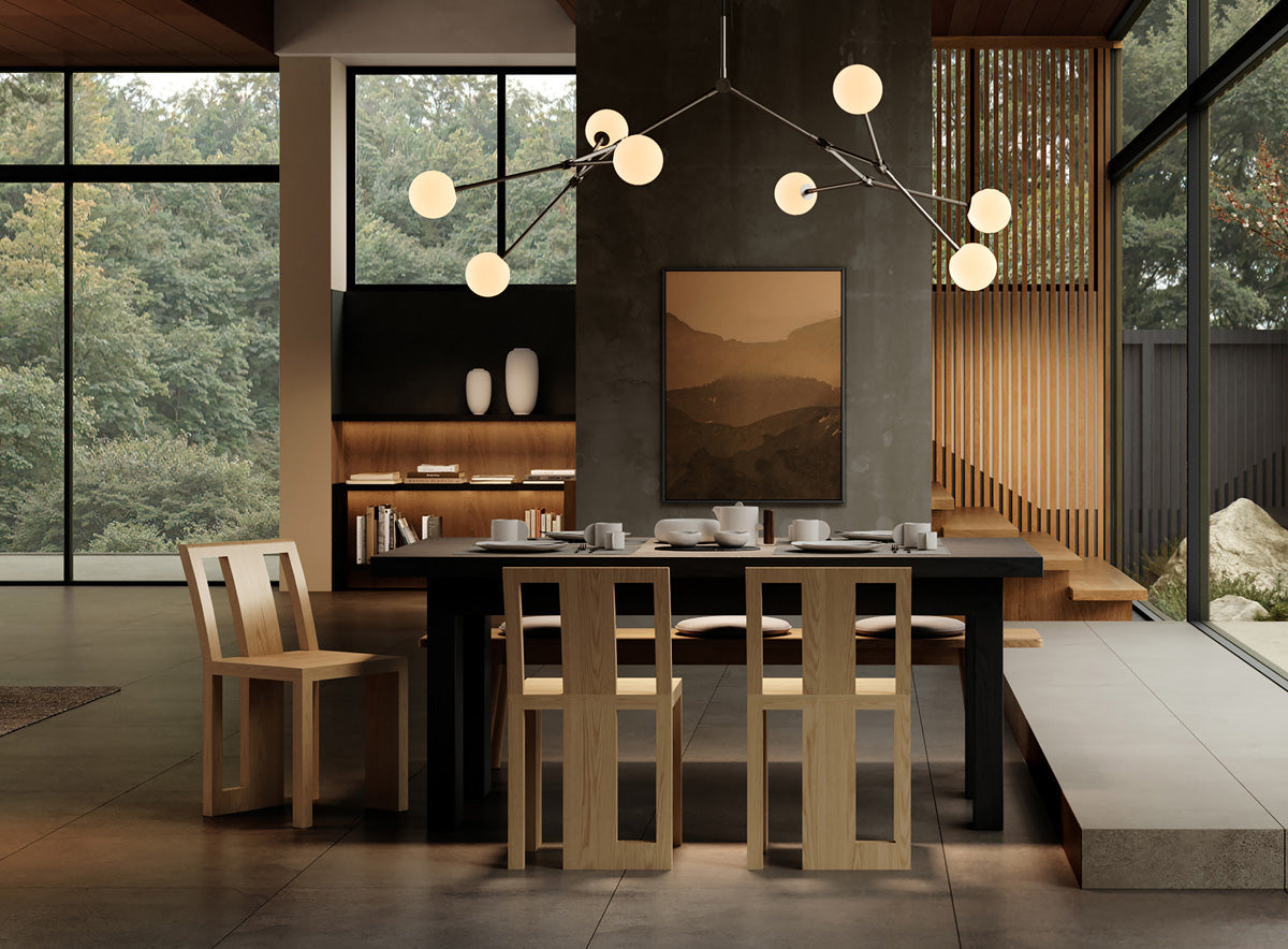 101 Copenhagen Drop Bulp chandelier over dining table with Atsu Oka dining chairs and Native dinnerware and Sunao vases