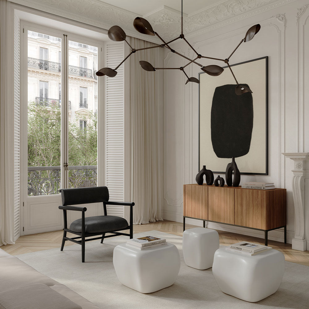 Modern living room with a Stingray Chandelier, Nama Lounge chair, Ishi Tables and Ni vases