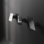 3 directions of Chameleon Wall lamp in Chrome lit and off.